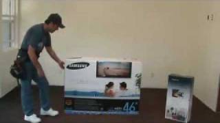 Removing a big flat screen HDTV from the box [upl. by Guinevere]