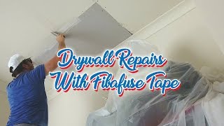 Drywall Repair Patch Step 2 Using Fibafuse Jointing Tape [upl. by Ahsineb]