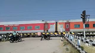 The Red Train thrashes a Level crossingIndian Railways YPR GKP Exp [upl. by Cinemod]