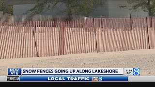 Crews put up snow fences along the lakeshore [upl. by Eahsal]