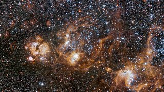 Panning across the rich region around the Tarantula Nebula in the Large Magellanic Cloud [upl. by Asserrac]