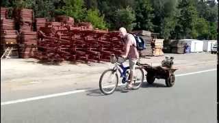 Перероблений велосипед з моторомRecycled bicycle with motor which pushes a wheelbarrow wheel [upl. by Macnair]