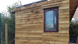 Cladding the pallet sheds DIY pallet shed man cave shed [upl. by Trini]