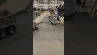 Custom built RC tow truck towing a tractor trailer truck at Cabin Fever Expo [upl. by Nitsoj]