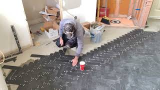 Herringbone Tile Floor Time lapse Install [upl. by Anstice]