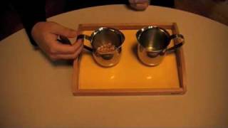 Montesori  Practical Life  Preliminary Exercices  Pouring Grains [upl. by Ajnot32]