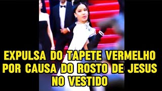 MASSIEL TAVERAS IMPEDIDA DE MOSTRAR VESTIDO DESENHADO COM ROSTO DE JESUS EM CANNES noticia [upl. by Emmuela765]