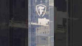 Large Firestone logo being added to the north side of Bridgestone Tower in downtown Nashville [upl. by Assital]