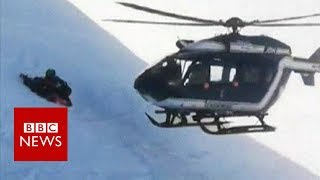 Skiers rescued in dramatic helicopter manoeuvre  BBC News [upl. by Stanhope398]