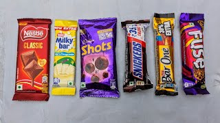 Lots of chocolate Munch Crispello Gems Snickers Shots Classic Fuse MilkyBar Perk Bar One Chocolate [upl. by Ecirpak302]