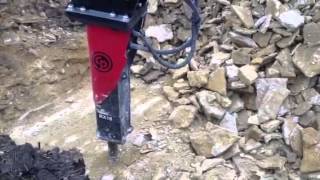 Komatsu excavators and Chicago Pneumatic RX18 hammer [upl. by Adnilema]