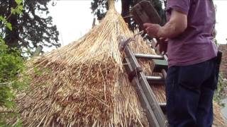 Thatching a round straw roof iron age hut thatch style [upl. by Ulla561]