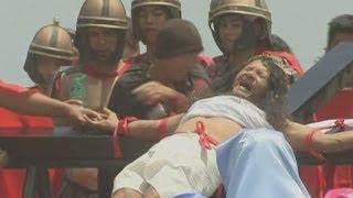 Good Friday crucifixion rituals Philippine devotees nail hands and feet to wooden crosses [upl. by Rudwik]