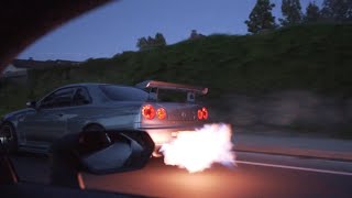 Street race Nissan R34 Skyline MASSIVE FLAMES vs Supercharged Lamborghini Huracan [upl. by Aisenat]