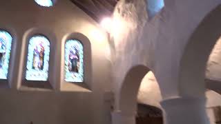 Ringing the bell for a service at historic St Cadfans Church in Tywyn Gwynedd CymruWales 26624 [upl. by Ahsenik]