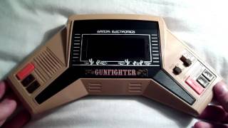 Bandai Gunfighter Handheld electronic game review [upl. by Elleivap]