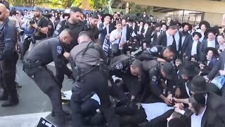 UltraOrthodox Jews block highway over Israeli Supreme Court decision on military service [upl. by Imerej]