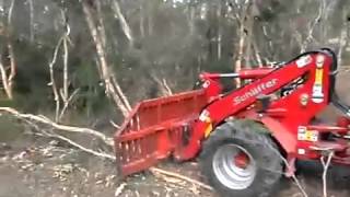 Front end loader Schaffer 5050Z being used as a bulldozer with stick rake in Australia [upl. by Huntley744]