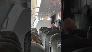 Woman Coughs on Passengers as Shes Escorted Off Plane for Not Wearing Mask [upl. by Cleve]