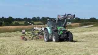 Andainage 2014 avec deutzfahr et un andaineur claas doubles toupies [upl. by Lanctot]