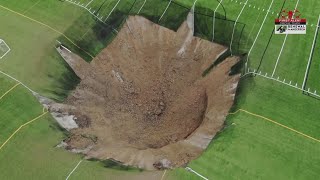 Video shows massive sinkhole open up in the middle of soccer field in Illinois [upl. by Stanfield]