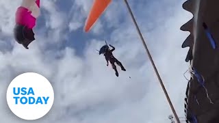 Paraglider loses control crashes through roof  USA TODAY [upl. by Haukom99]