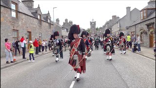 Chieftain leads the massed Pipes and Drums on the march to 2023 Dufftown Highland Games in Scotland [upl. by Standford787]