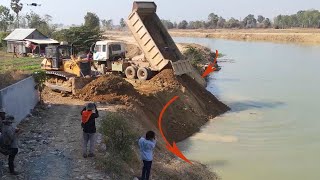 Excellent Movement Dozers D60P Fill Soil in Canal with Several Dump Trucks to Widen Road [upl. by Garfield371]