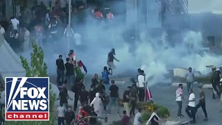 DEVELOPING Riot police clash with protesters in West Bank [upl. by Wernick506]