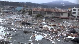 Tsunami in Kesennuma city ascending the Okawa river [upl. by Timothee621]