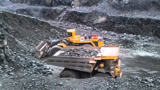 Komatsu WA1200 loading CAT 789 at Titania Norway [upl. by Alywt483]