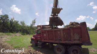 John Deere excavator loading a Ford L8000 dump truck [upl. by Nolrah]