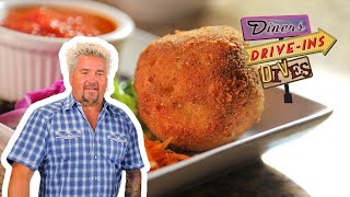 Guy Fieri Eats Luigis Arancini  Diners DriveIns and Dives  Food Network [upl. by Karlotta45]