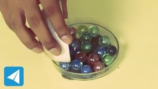 Marbles illustrate the action of ball bearings  Friction  Physics [upl. by Gnohc]