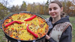 Ukrainian woman cooks tradition Pilaf on an open fire in the village [upl. by Beau]