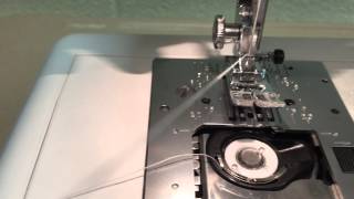 Threading your JanomeManual bobbin threading [upl. by Attenohs]