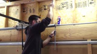 How To Tighten the Garage Door Spring [upl. by Comptom]