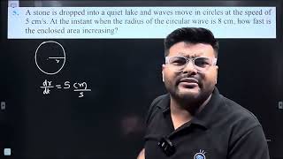 5A stone is dropped into a quiet lake and waves move in circles at the speed of 5 cms At the inst [upl. by Rennerb526]