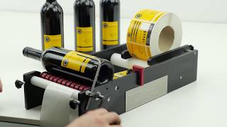 Wine Bottle Labeller  Wine Bottles being Labelled on the BenchMATE Label Applicator [upl. by Bainter]