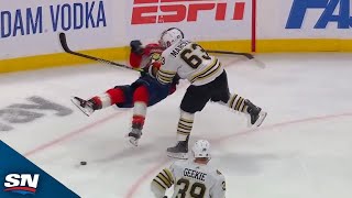 Brad Marchand Knocks Down Matthew Tkachuk With Massive Hit [upl. by Hetty]