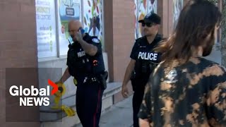 Toronto shooting Suspects open fire kill woman on Queen Street [upl. by Ahsiea]