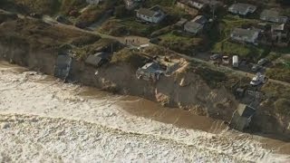 Worst tidal surge in 60 years batters UK east coast and drags homes into the sea [upl. by Kitarp]