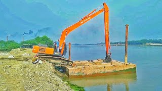 EXCAVATOR pontoon unloading TATA HITACHI EX 215 super long reach [upl. by Adneram]