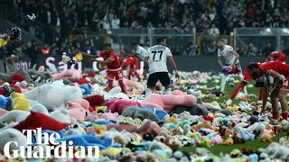 Toys thrown on pitch by Besiktas fans for children affected by Turkey earthquake [upl. by Mlohsihc]