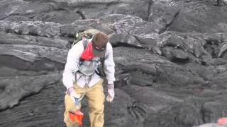 Geologist collects a fresh lava sample in Hawaii in May 2014 [upl. by Germano]