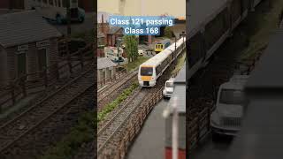 Class 121 passing Class 168 modelrailway oogauge train [upl. by Eicul]