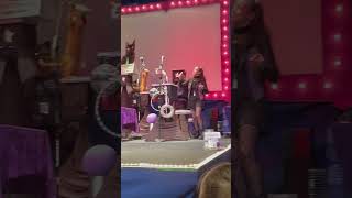 Group of cats play instruments on stage during [upl. by Ennairb]