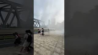 Tide of Qiantang River showers spectators on bridge [upl. by Ardien]