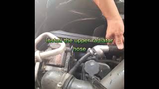 Isuzu 4JA1T thermostat and housing installation [upl. by Yrret]