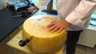 opening a wheel of parmesan cheese parmigiano reggiano [upl. by Arihsan]